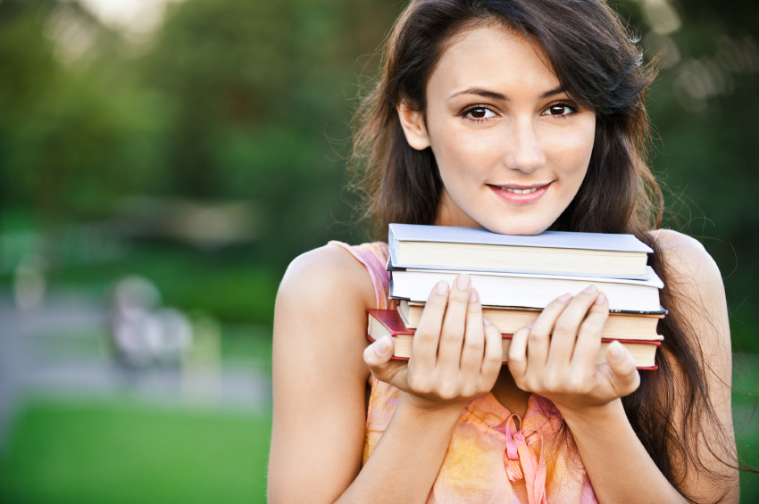 Girl-student holds textbooks
